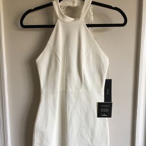White bodycon dress with lace detail on back